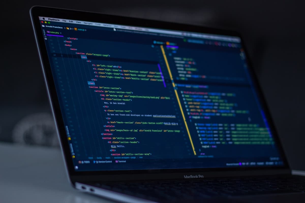 Laptop displaying source code in an editor