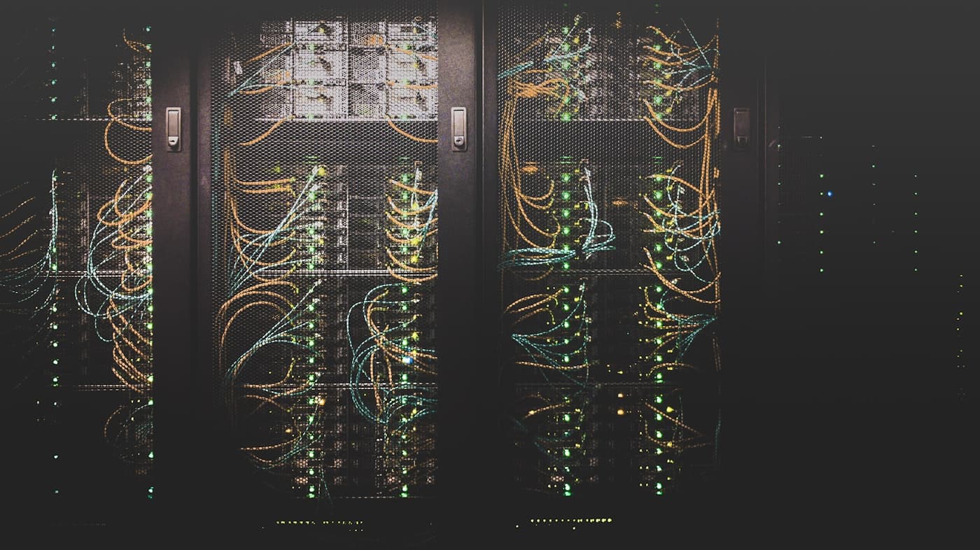 Racks of cabled servers inside a data centre