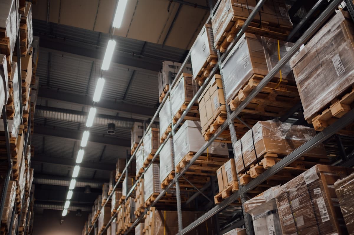 Cardboard cartons shelved in order across warehouse racking
