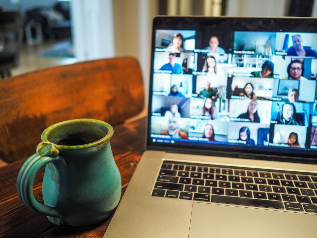 Laptop showing a grid of colleagues on a video call